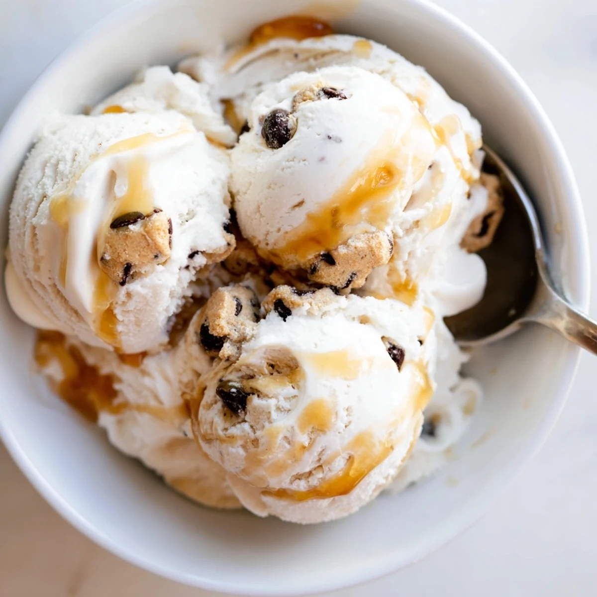 Creamy cottage cheese ice cream swirled with indulgent chocolate chip cookie dough bites.  