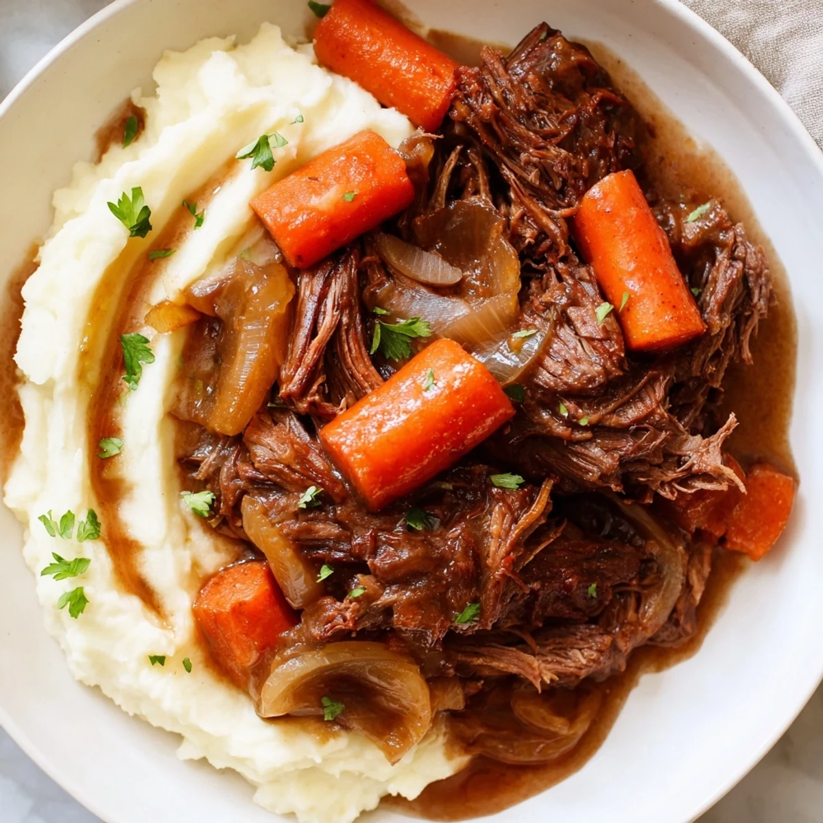 Hearty slow cooker pot roast, fall-apart beef in rich gravy with carrots and celery, yum!