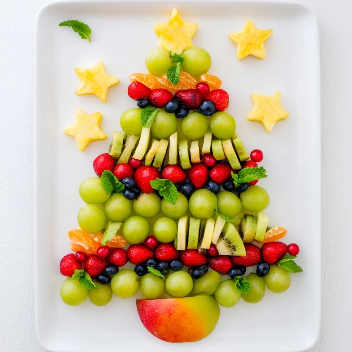 Vibrant Quick Christmas Tree Fruit Platter, layered with colorful fruit, perfect for a festive appetizer.