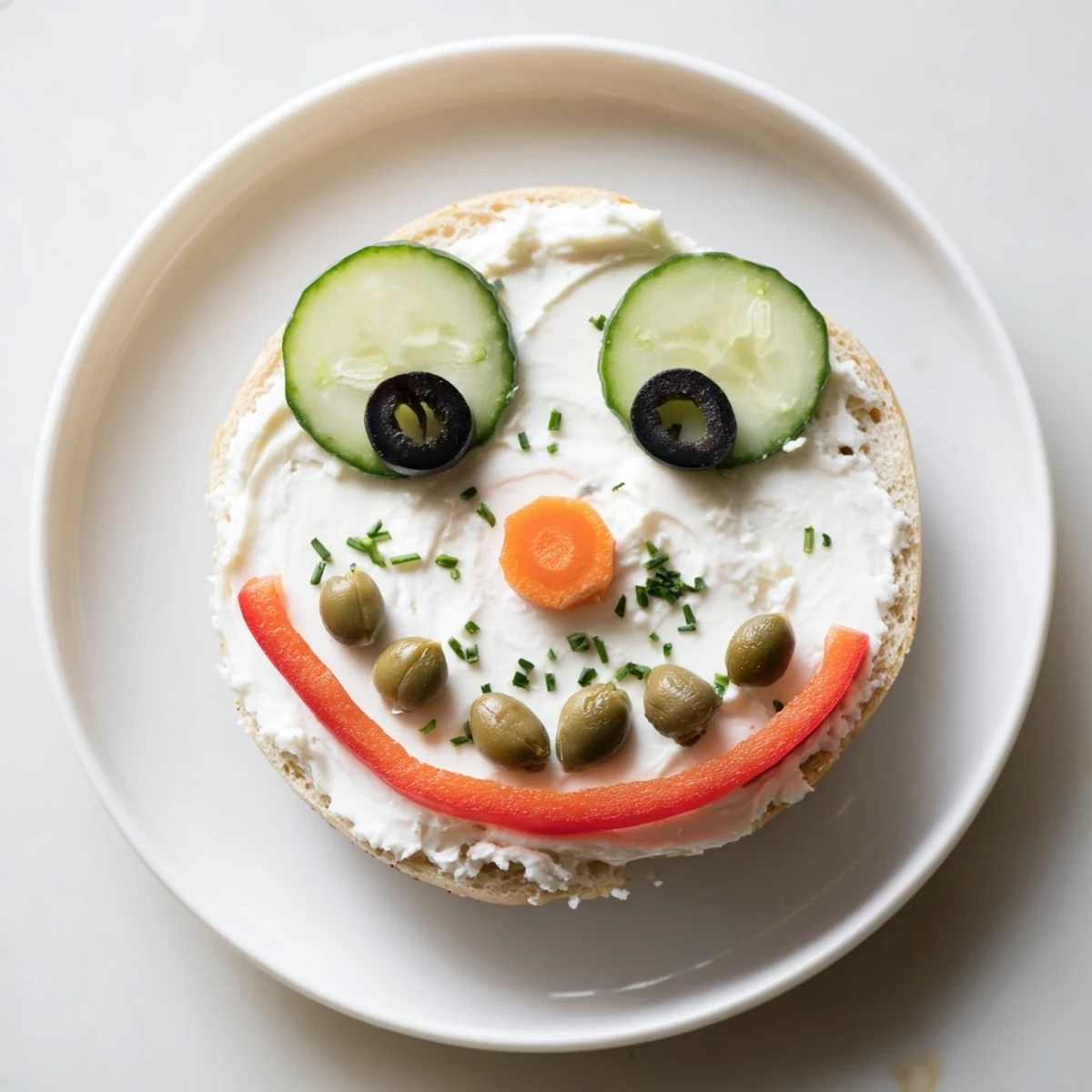 Festive snowman mini bagel sandwiches with cream cheese, vegetables, and creative touches, perfect kid-friendly snack.