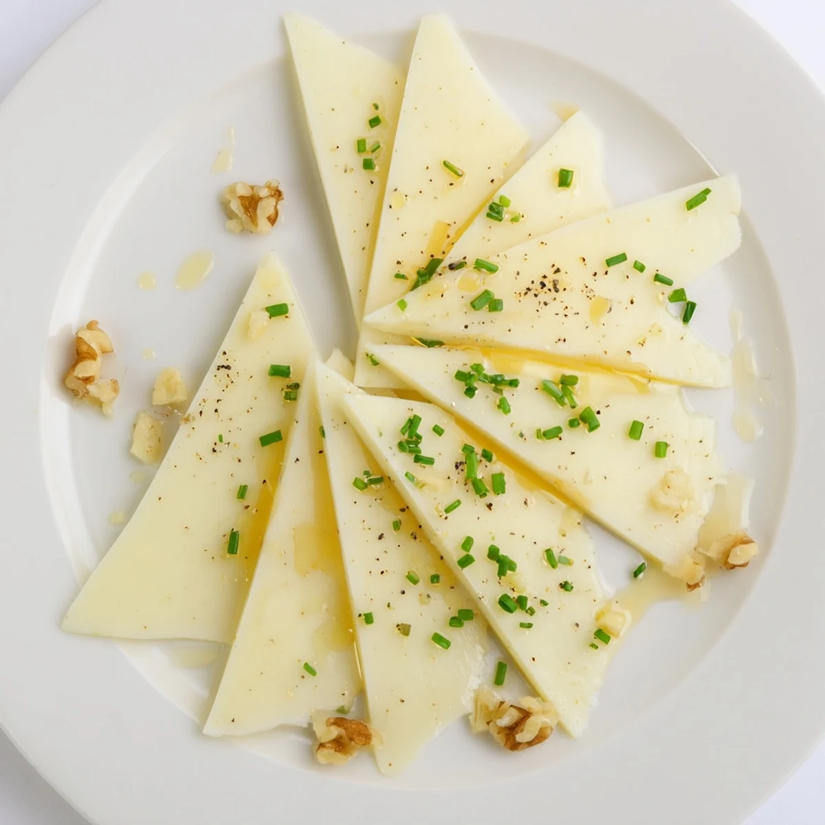 A close-up view of the Swiss cheese slices arranged in a fan shape, ready to serve.