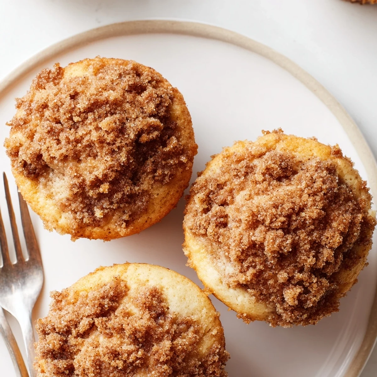 Warm, tender Lightened Christmas Coffee Cake Muffins ready to eat; imagine the holiday spices mingling.