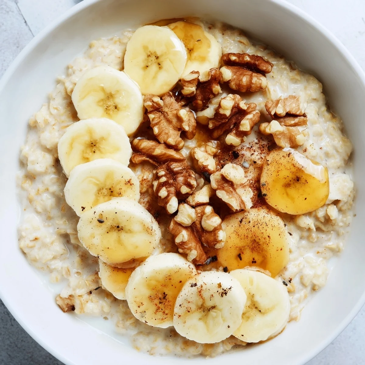Steaming bowl of Microwave Banana Oats with sliced bananas, ready for a warm and quick breakfast.
