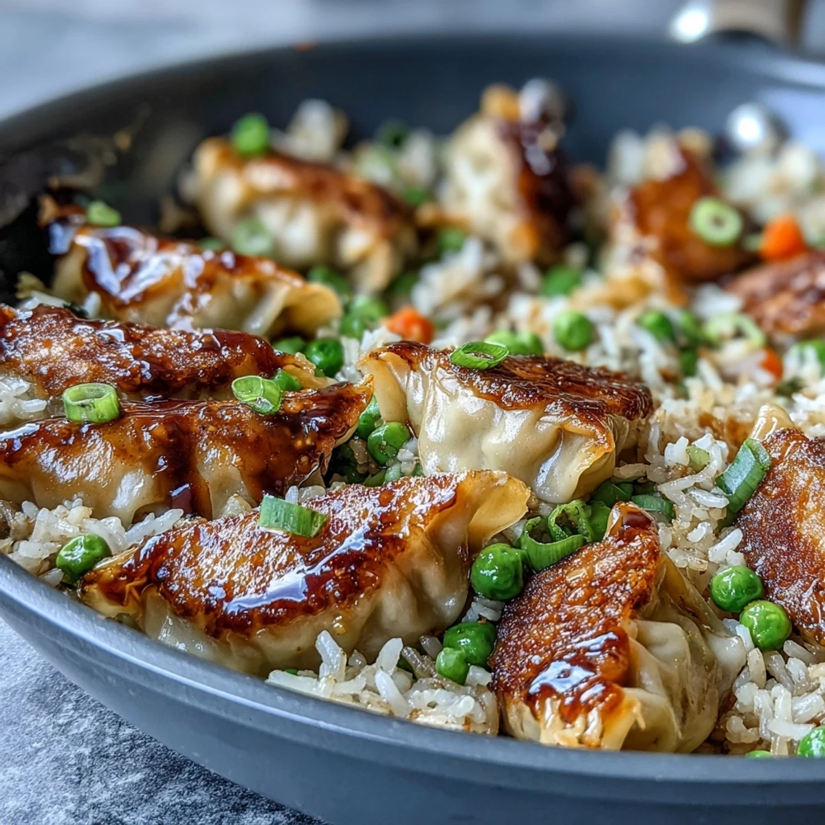 Easy Trader Joe's Dumpling Fried Rice: Leftover dumplings and rice tossed with vegetables and sesame oil for a quick dinner.  