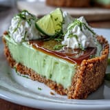 Refreshing no-bake key lime pie slice on crisp graham cracker crust.