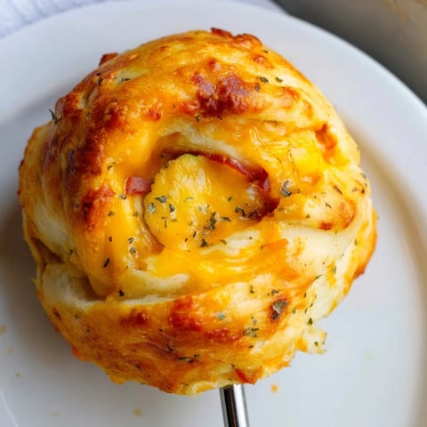 Flaky Cheesy Pickle Ham Biscuit Pops served warm and fresh from the oven.  