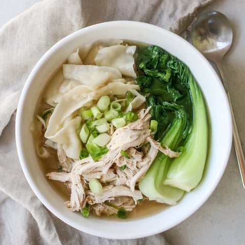 Warm and inviting Simplified Wonton Soup with savory chicken and fresh bok choy.  