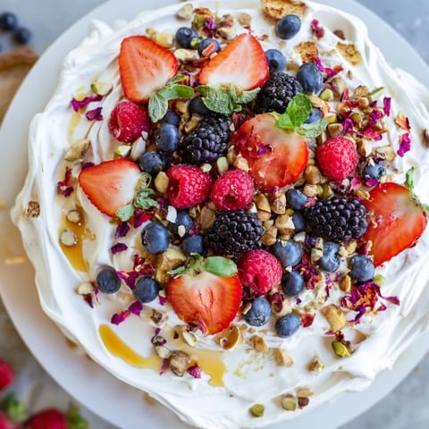 Creamy Butter Board Dessert Version topped with fresh berries and crunchy nuts.  