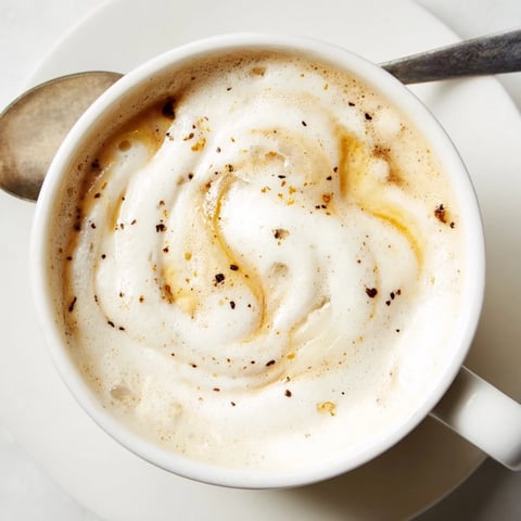Rich onion latte topped with frothy milk, perfect for adventurous coffee lovers.  