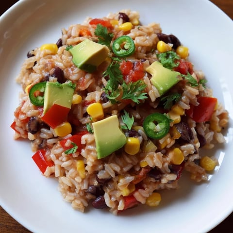 Steaming One-Pot Mexican Rice & Beans, a flavorful vegetarian main course with fresh cilantro garnish.
