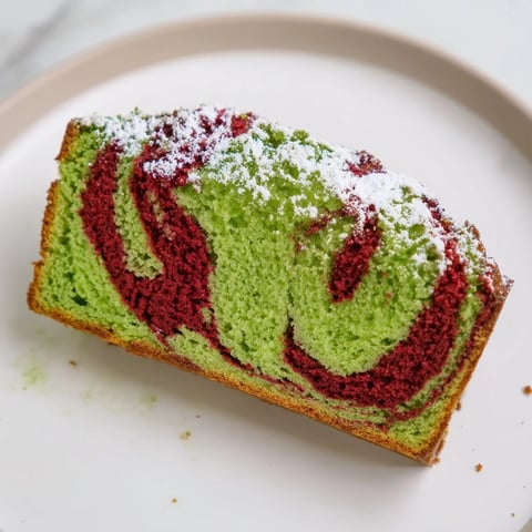 Sliced Red & Green Swirl Matcha Marble Pound Cake showcases beautiful, swirled layers and a moist texture.