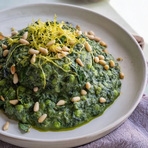 Creamy Green Pea & Spinach Pasta swirled with vibrant, fresh sauce, ready to be served.