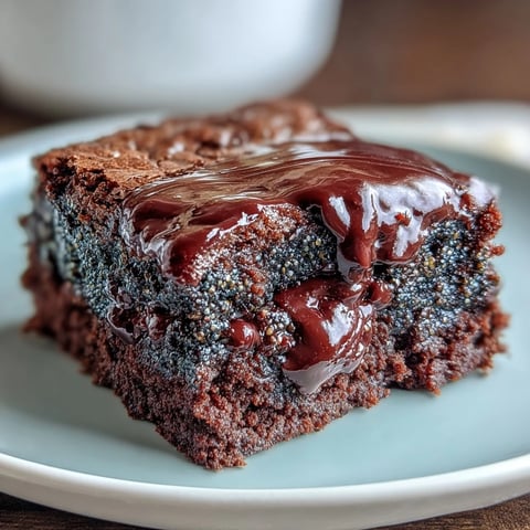Rich black sesame brownies with fudgy chocolate layers and nutty swirls, perfect for dessert lovers.  