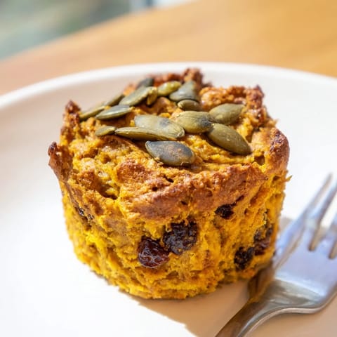 Savory-sweet Spicy Japanese Curry Pumpkin Muffins garnished with toasted pumpkin seeds for added texture.  