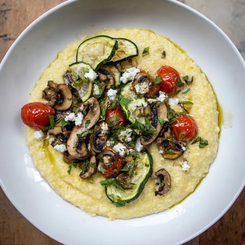 A close-up of a Cornmeal Mush Polenta Bowl showcasing a warm, comforting vegetarian dinner option.