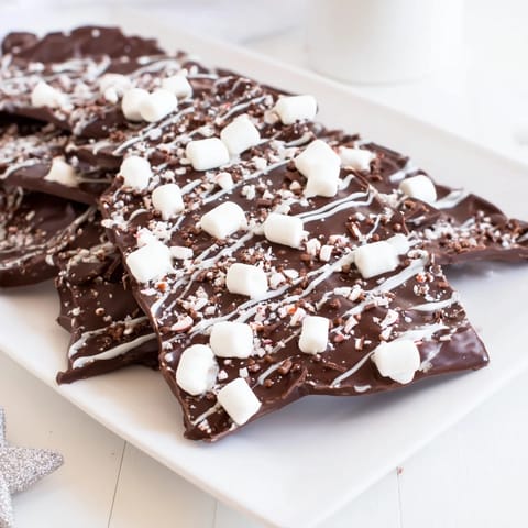 Homemade Hot Chocolate Bomb Bark with swirled white chocolate looks utterly tempting and delightful.
