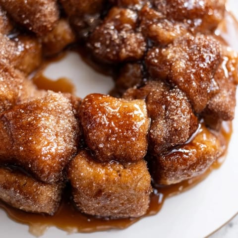 Cinnamon-sugar coated pieces make up this delicious Easy Christmas Morning Monkey Bread, a perfect holiday treat.