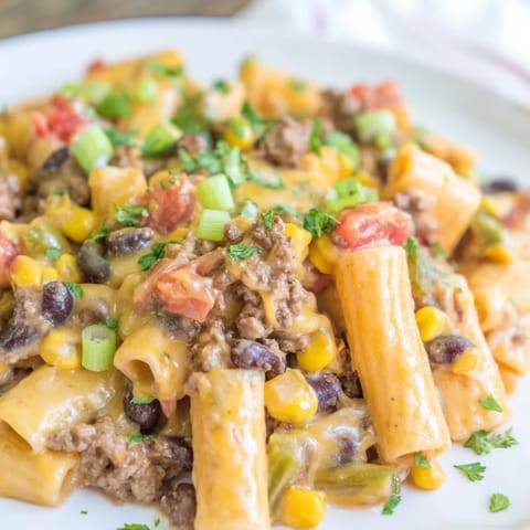 Steaming bowl of delicious Cheesy Taco Pasta, filled with tender pasta and melted cheese.