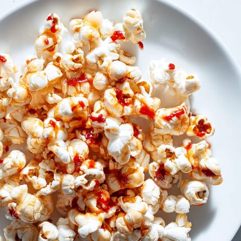 Close-up of freshly made Hot Honey Butter Popcorn: sweet, spicy, and buttery deliciousness.